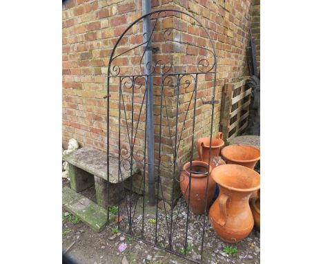 A wrought iron garden gate 