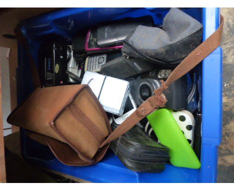 Box of assorted camera and phones