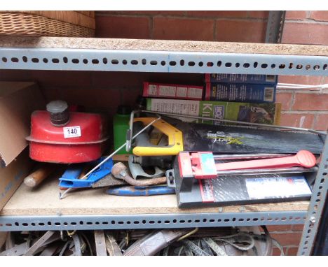 Assorted tools including tile cutter, jerry can and Hozelock sprayer