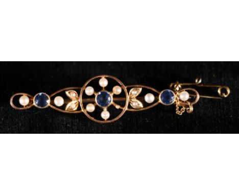 Fifteen carat gold sapphire and seed pearl openwork bar brooch, 3.6g CONDITION REPORT: Good condition.  Marked '15ct'.  In a 