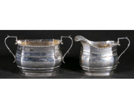 Silver sucrier and cream jug of rectangular form with beaded rim, maker RC, Birmingham 19254, 341g gross.