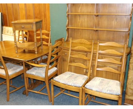 Ercol thirteen-piece ash dining room suite comprising of a dining table, ten ladderback chairs, dresser and occasional table.