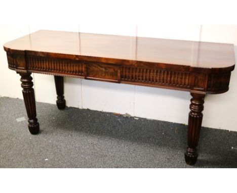 William IV mahogany serving table raised on fluted supports, 88cm x 198cm wide x 75cm dia CONDITION REPORT: Screw holes to re