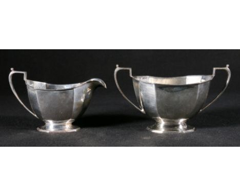 Silver sucrier and cream jug of faceted oval form, Sheffield, 296g gross