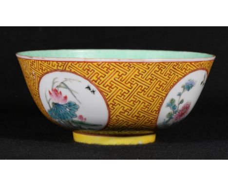 19th century Chinese yellow ground bowl decorated with four bird and flower panels reserved on a geometric ground, scroll hon