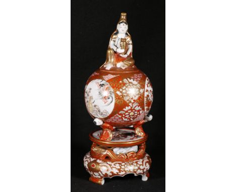 Japanese Kutani censer of spherical form, the body supported on three figure supports, the finial to the lid in the form of K