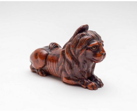 A lion fruitwood snuff box, 19th Century, crouching, with tortoiseshell veener to inside 11cm long, 7cm high  CONDITION REPOR