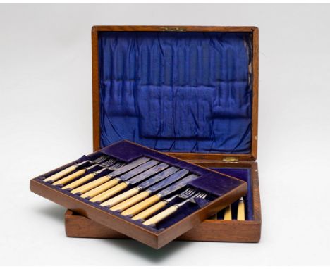 An Edwardian cased set of twelve silver fish eaters, Atkin Brothers, Sheffield 1910 and 1911, with ivorine handles (one fork 