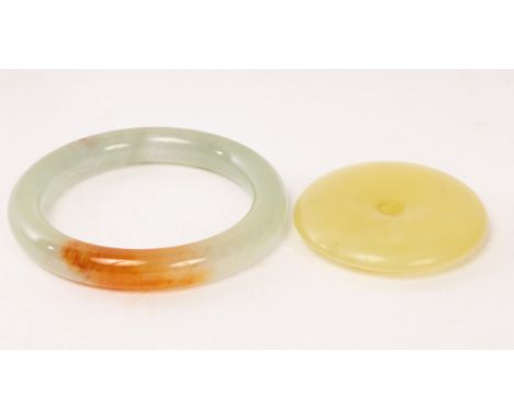 A Chinese yellow jade carved disc, 20th Century, Yubi, and a jade bangle, the bangle internal diameter 5.5cm CONDITION REPORT