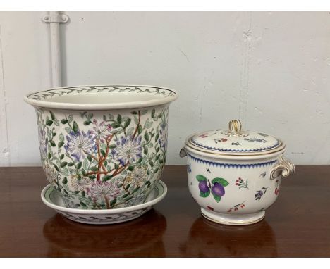 A ceramic ice bucket, by Richard Ginori, decorated flowers with gilt highlights, handles to sides and decorative finial to li
