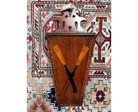 A George III mahogany and inlaid candle box, the front inlaid with a knife a fork with a straw-work border, 49.5cm high, 20cm