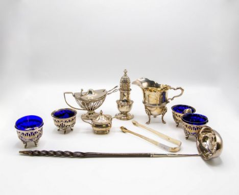 A quantity of silver cruets, various dates and makers, including a set of four open salts with blue glass liners, London 1905