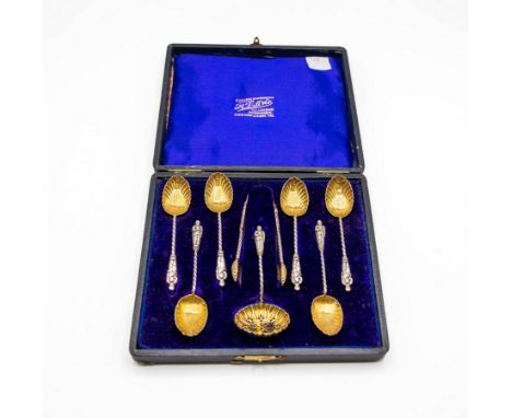 Six Edwardian silver apostle coffee spoons, Robert Pringle, Birmingham 1908, with shell bowls and spiral handles, a matching 