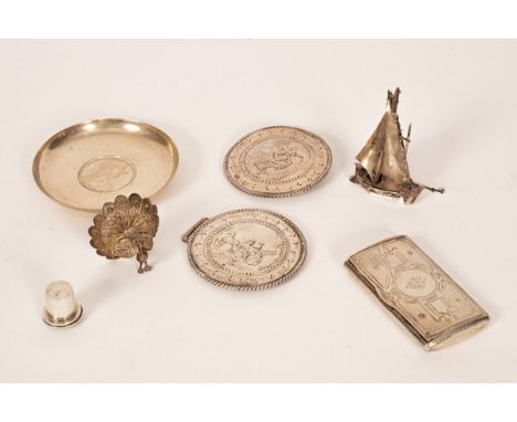 A Continental silver snuff box, the hinged cover with foliate and engine turned decoration, a white metal boat, a filigree fi