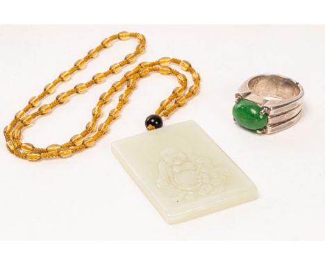 A Chinese jadeite and silver ring and a jade carved plaque, 20th Century, the later carved Mile Buddha, 5.5cm x 4cm CONDITION