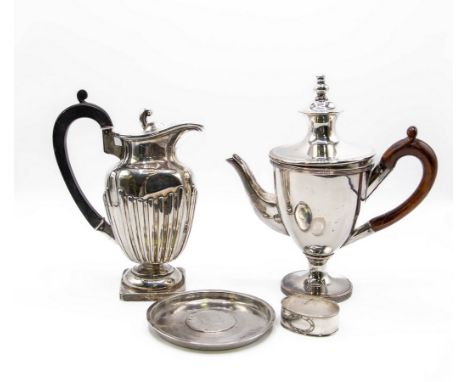 A silver hot water jug, TH, Birmingham 1895, the hinged cover with scroll finial, fitted an ebonised handle, 18.5cm high appr