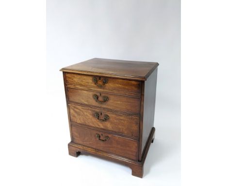 A George III mahogany chest commode, with a cupboard above a commode drawer on bracket feet, 61cm wide, 46cm deep, 72cm high 