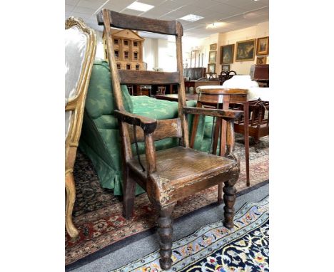 A Welsh rustic elm ladder back chair, with solid seat on turned legs and metal supports to the arms, 101cm high, seat height 