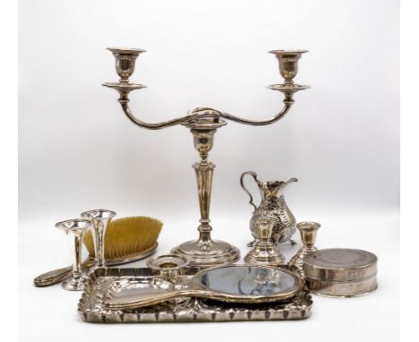 An Edwardian embossed silver trinket tray, London 1904, a silver mounted hair brush and hand mirror, a pair of silver vases, 
