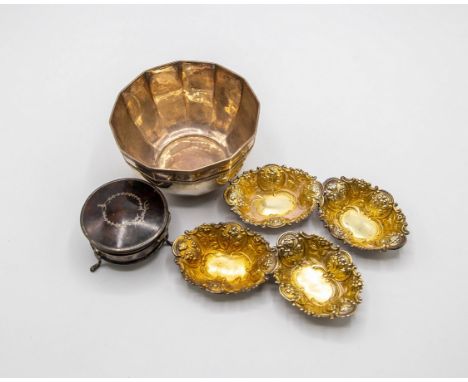 Four late Victorian silver sweetmeat dishes, William Edwards, London 1892, oval repoussé decorated with gilt interiors, 7cm w