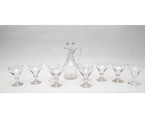 A claret jug and stopper with panel cut body below a triple-ring-neck and a set of nine rummers with bladed knops, the jug 28