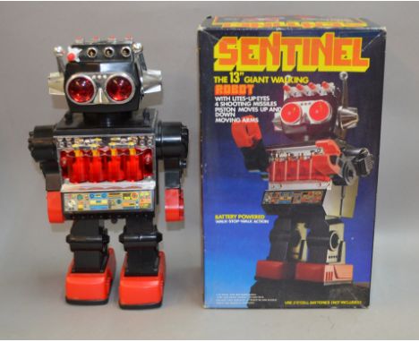 Sentinel, Chinese made battery operated plastic robot, height 30 cm, black body with red hands and feet and chrome detailing,