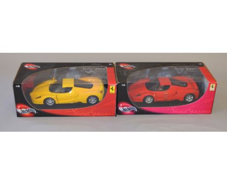 Two 1:18 scale Mattel Hot Wheels Ferrari diecast models, same model in colours yellow and red. Boxed, overall G-VG (2)