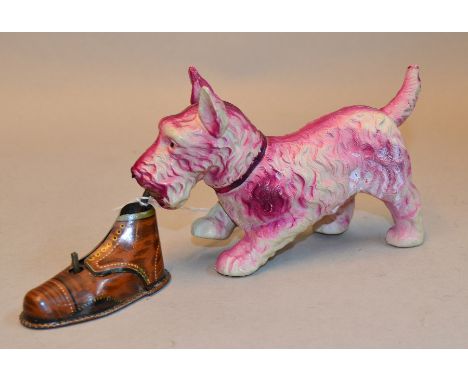 KT (Japan) 'Cheeky Scotch' Celluloid Dog with Boot: when tinplate clockwork boot wound dog 'shakes boot', length of dog 15cm.