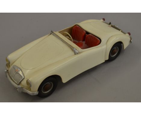 Victory Industries 1/18 scale MG model: cream with red interior, black rubber wheels. Lacks windscreen, unboxed.