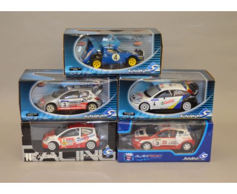 Five 1:18 scale Solido diecast model vehicles including: Lancia Stratos - 1979 / Peugeot 206 WRC - Panizzi; Ford Focus WRC; T