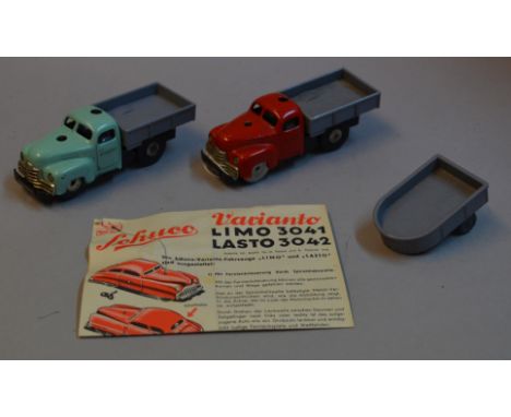 Two Schuco Varianto Lasto 3042 clockwork tinplate models with plastic backs, length 11cm, one with turquoise cab and the othe