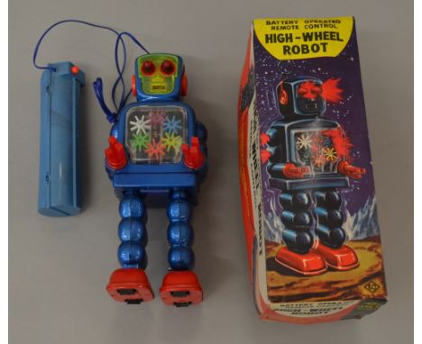 KO Yoshiya (Japan) High Wheel Robot: battery operated tinplate model with remote control unit, metallic blue, red tinplate fe