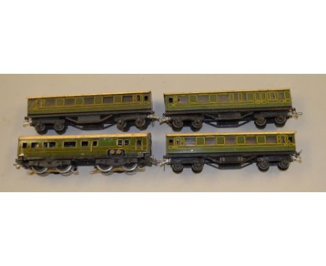 OO Gauge Trix Twin Railway:- Pre-war Southern EMU driving car with 3 x coaches. Rare item in F condition. (Some rust spots to