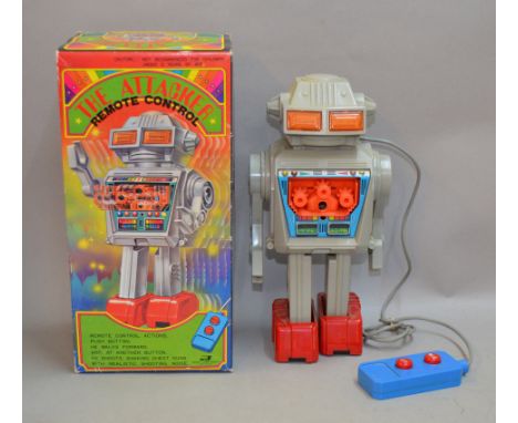 Junior Toys (Japan) The Attacker, battery operated remote control robot, grey plastic body with red feet, tinplate and plasti