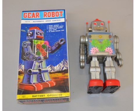 H Horikawa (Japan) Gear Robot: battery operated, silver tinplate body with red feet and speed dial to head, clear chest panel