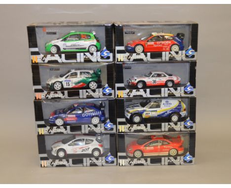 Eight 1:18 scale solido diecast model vehicles including: BMW X5 Rallye X-Raid 2004; Peugeot 307 WRC; Citroen Xsara WRC; Peug