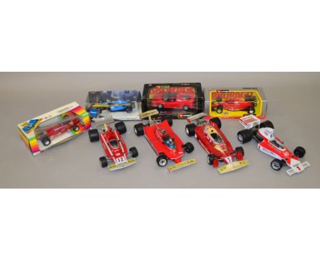 8 x Large scale F1 racing cars includes 1:14th scale Ferrari, 1:16th scale McClaren, 1:24 scale F50 Ferrari, Etc. Some slight
