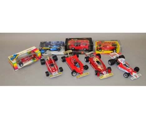 8 x Large scale F1 racing cars includes 1:14th scale Ferrari, 1:16th scale McClaren, 1:24 scale F50 Ferrari, Etc. Some slight