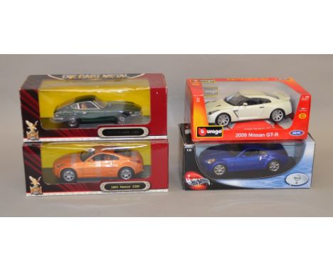 Four assorted diecast 1:18 scale model vehicles including: Mattel Hot Wheels Nissan z; Burago 2009 Nissan GT-R; 2x Yat Ming 1