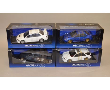 Four 1:18 scale Auto Art diecast model vehicles including: Subaru New Age Impreza WRX; Lancer Evolution etc. All boxed, overa