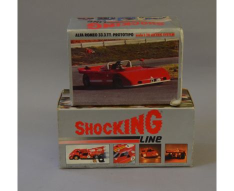 Two boxed diecast model vehicles including: Shocking Line Ferrari 512 Prototipo; Alfa Romeo 33.3 TT. Prototipo. Together with