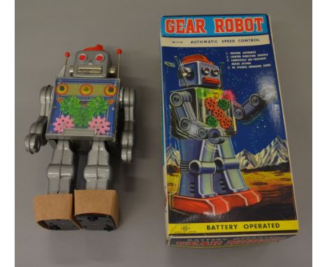 SH Horikawa (Japan) Gear Robot: battery operated, silver tinplate body with red feet and speed dial to head, clear chest pane