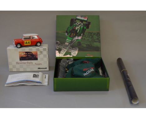Jaguar Racing official licensed set including: Personal letter; Magazine; 2x Jaguar Racing caps (tags still attached); Wall f