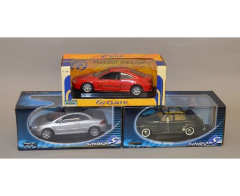 Two Solido 1:18 scale diecast model vehicles: Peugeot 307 CC/ 203 Decouvrable 1954. Together with a Gateway Global Peugeot 40