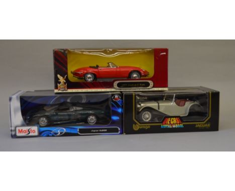 Three 1:18 scale diecast model vehicles including: Burago Jaguar SS100 (1937); Maisto Jaguar XJ220; Yat Ming 1971 Jaguar E-Ty