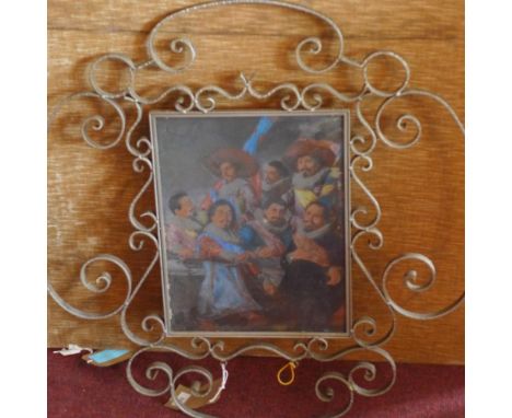 An early 20th century Dutch pub sign, with glass panel depicting soldiers, within scrolling cast metal frame, 74 x 74cm (fram