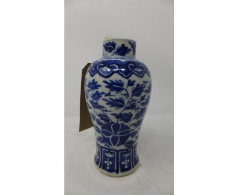 A late 19th century Chinese blue and white porcelain vase, with floral design, bears four character mark to base, H.19cm 