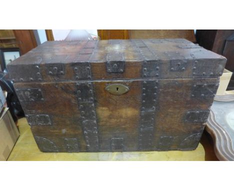 A mid to late 19th century oak and cast iron bound campaign trunk, bearing brass plaque for J.B.T. Newbury Esq., 56th Regimen