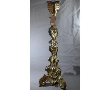 A large 19th century Rococo style silver plated altar pricket stick, embossed decoration, raised on scrolling feet, H.114cm 