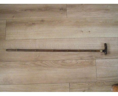 A 19th century faux tortoiseshell and bamboo walking stick by Brigg, with 14K yellow gold collar, hallmarked, monogrammed L.B